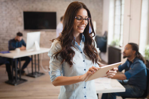 istock Beautiful woman working in architect and designer  modern office 673876534