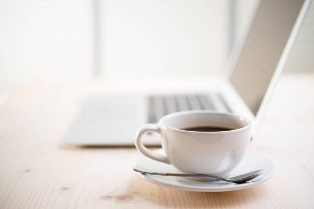 istock coffee and laptop on wooden table 673883798