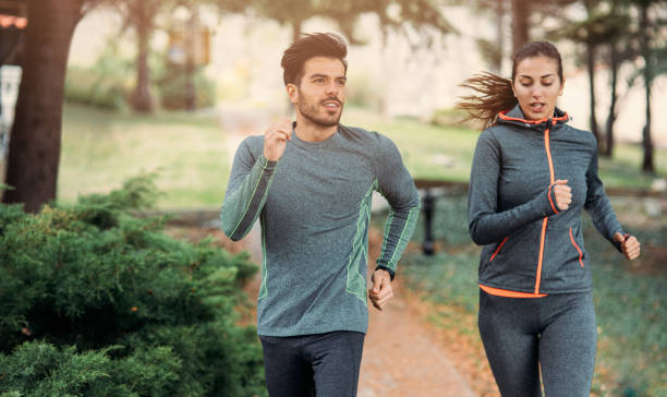 istock Friends jogging in the park 673884574