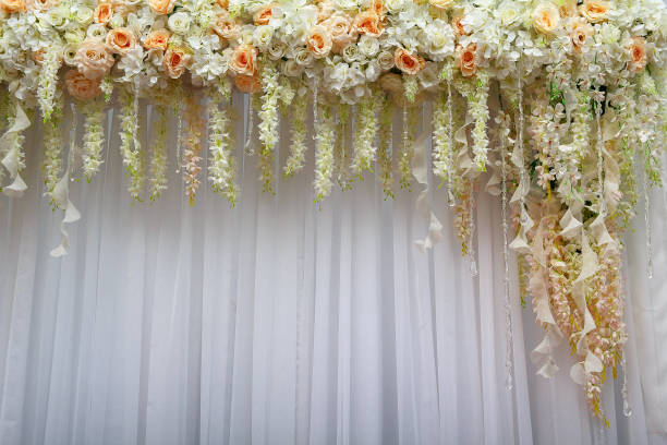 istock Beautiful background of flowers and white textiles 673885388