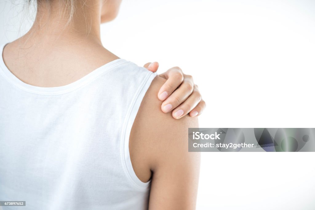 Woman with pain in shoulder. Pain in the human body,health care concept. Pain Stock Photo