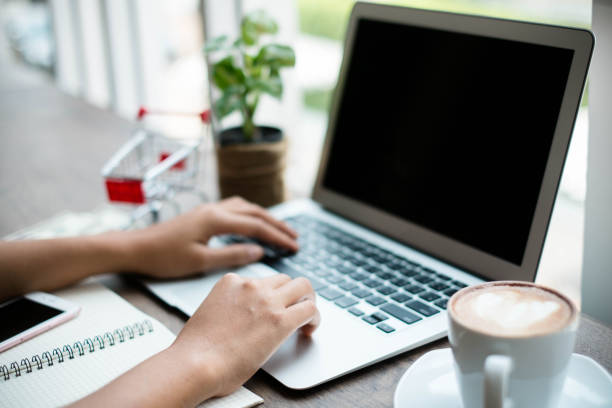 istock Young woman using laptop computer. Online shopping concept 673898416