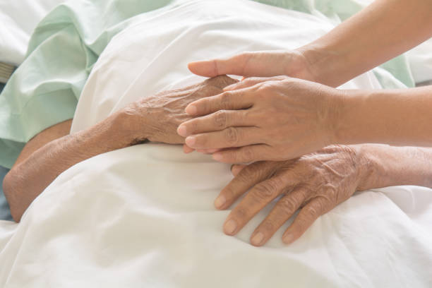 istock hospital patient hands to care 673903974