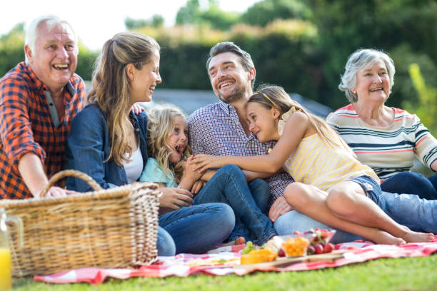istock Happy multi-generation family sitting on blanket 673904492