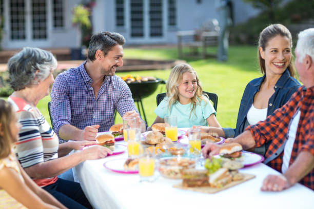 istock Happy multi-generation family sitting at table 673904674