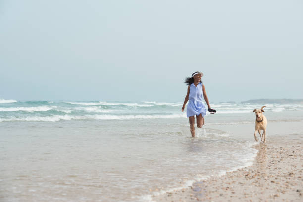 istock Beach walking with my best friend. 673904894