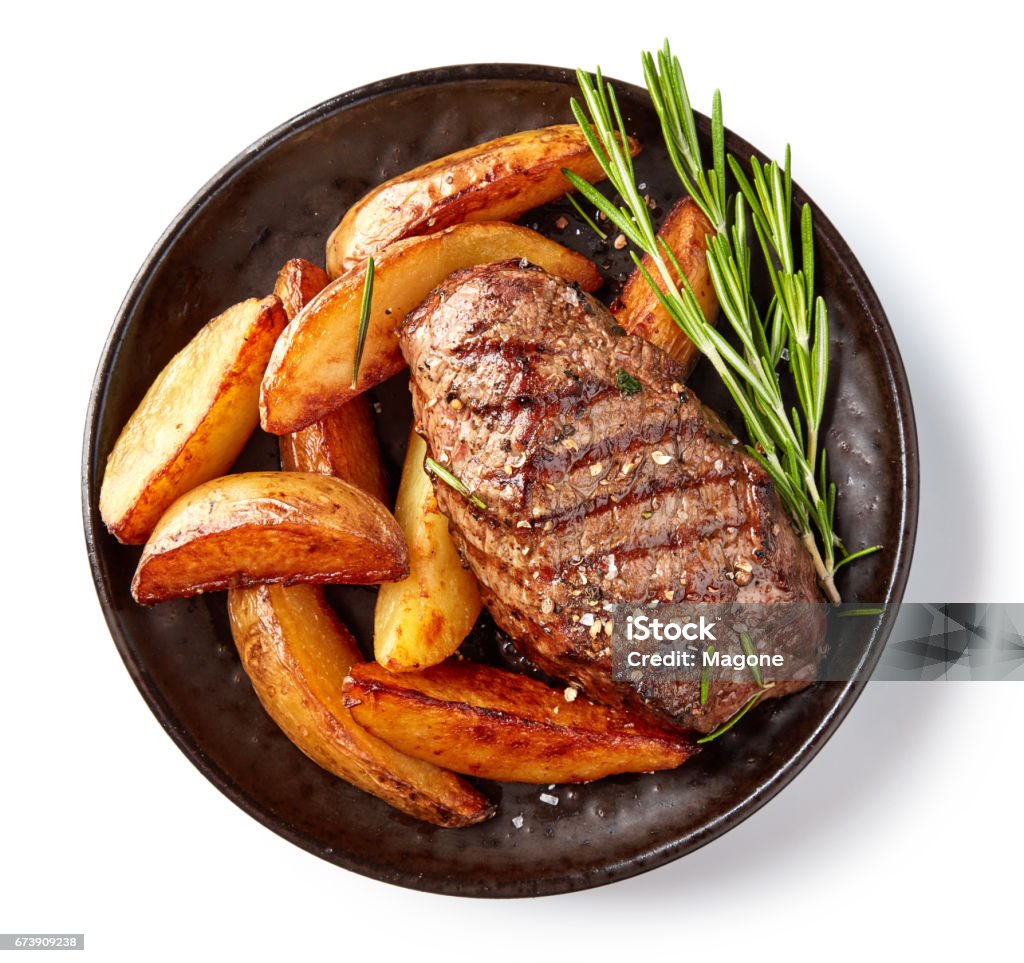 grilled beef steak grilled beef steak and potatoes on plate isolated on white background, top view Plate Stock Photo