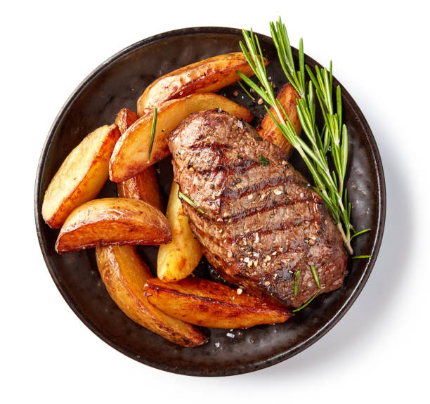 grilled beef steak grilled beef steak and potatoes on plate isolated on white background, top view meat stock pictures, royalty-free photos & images