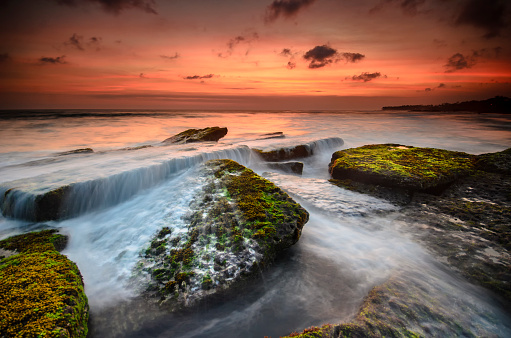 a sunset scenery at rocky beach, Bali, indonesia