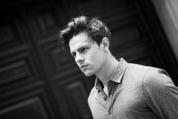 istock Confident and handsome young man in the street 673926248