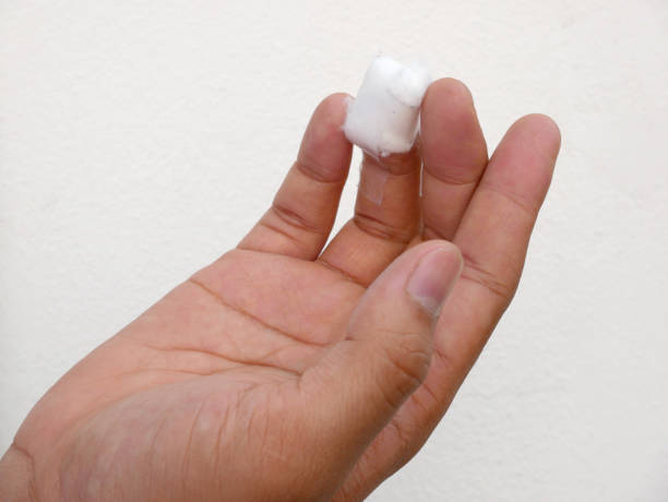 istock Hypodermic needle wound with cotton on arm 673932786