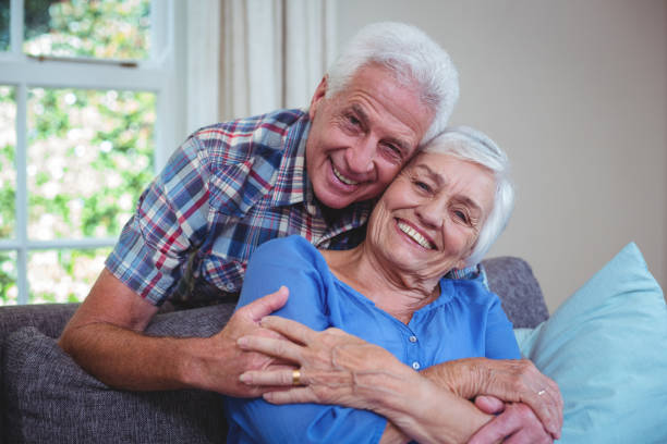 istock Happy senior man embracing woman from behind 673933136