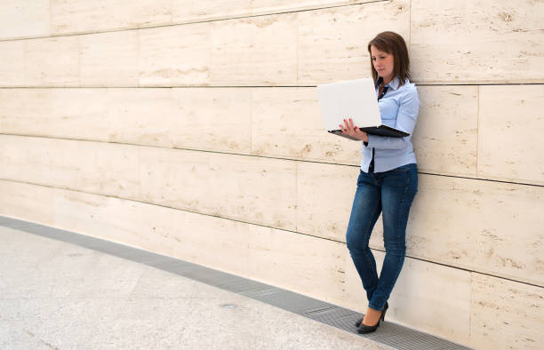 istock Cute woman working her laptop 673933324