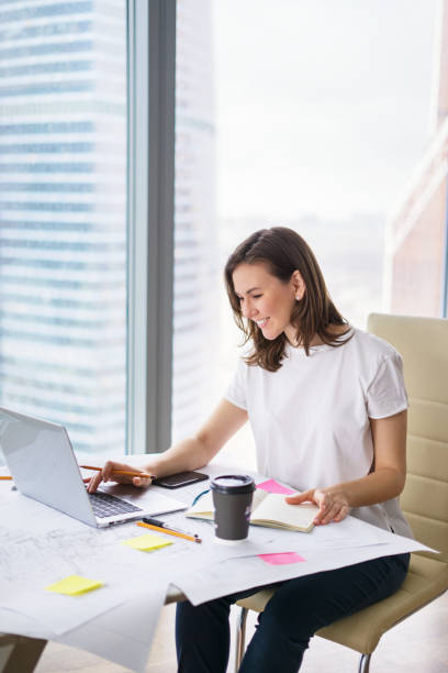 istock Young woman working in an office 673939598