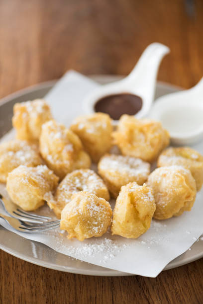 Kluay Tod chocolate kati, Thai fried banana with chocolate and coconut sauce.