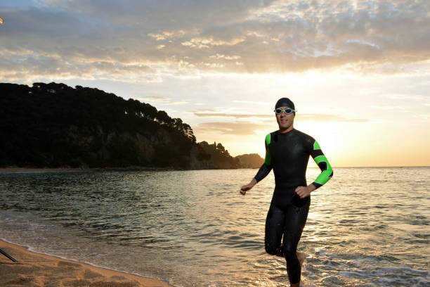 istock young athlete triathlon in front of a sunrise 673946942