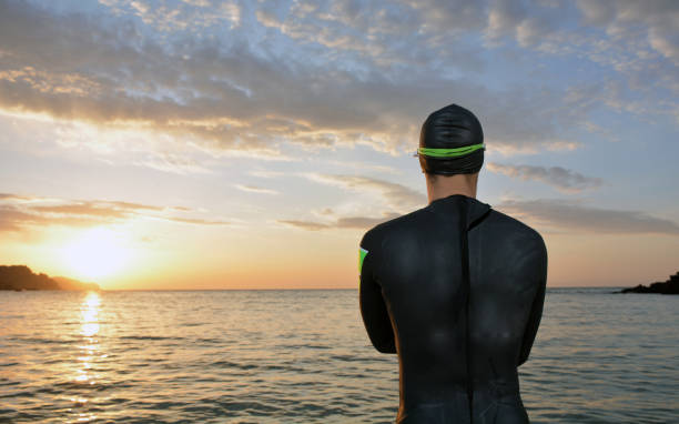 istock young athlete triathlon in front of a sunrise 673946944