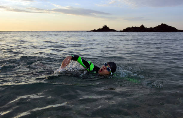 istock young athlete triathlon in front of a sunrise 673946954