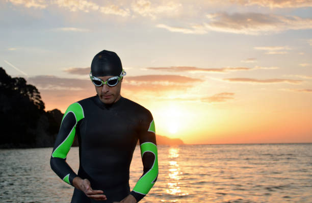 istock young athlete triathlon in front of a sunrise 673946958