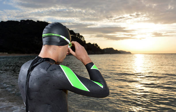 istock young athlete triathlon in front of a sunrise 673946960