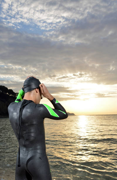 istock young athlete triathlon in front of a sunrise 673946972