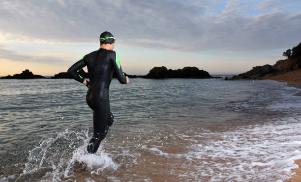 istock young athlete triathlon in front of a sunrise 673946998