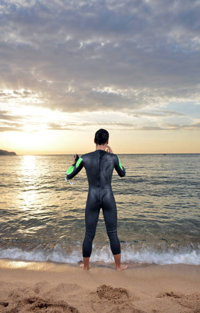 istock young athlete triathlon in front of a sunrise 673947016