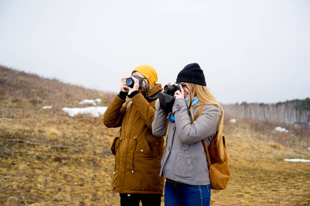istock Photographers on a hill 673947524