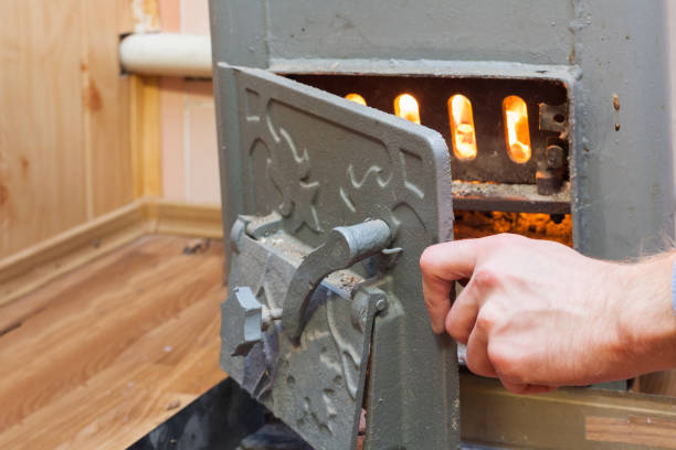istock Man close the door in Solid bio fuel boiler 673964828