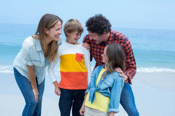 istock Parents enjoying with children at beach 673965032