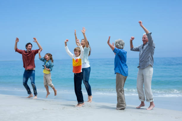 istock Multi-generation family enjoying at sea shore 673966796