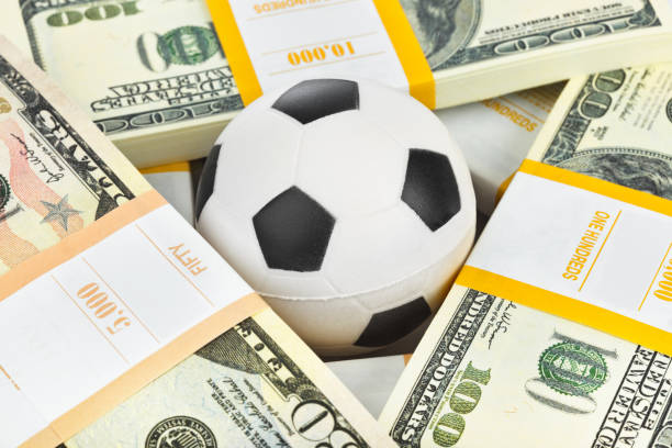 istock Money and soccer ball 673968546