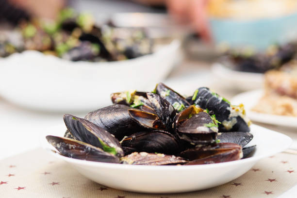 istock Steamed mussels in cheese sauce. 673976244