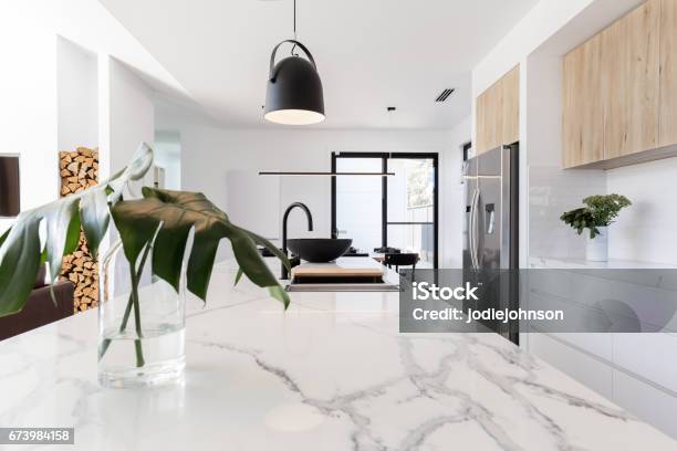 Kitchen Marble Bench Close Up With Black Hanging Pendant Stock Photo - Download Image Now