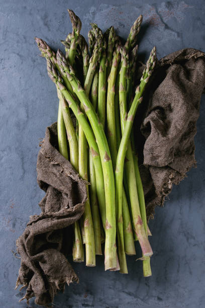 istock Bundle of young green asparagus 673990188