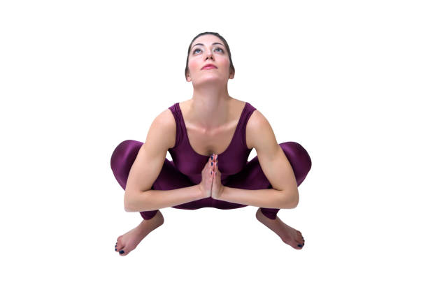 istock Calm pretty woman doing yoga exercise isolated on white background 673994270