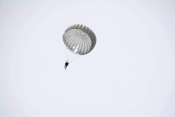 istock Parachute soldiers in the sky. 674006506
