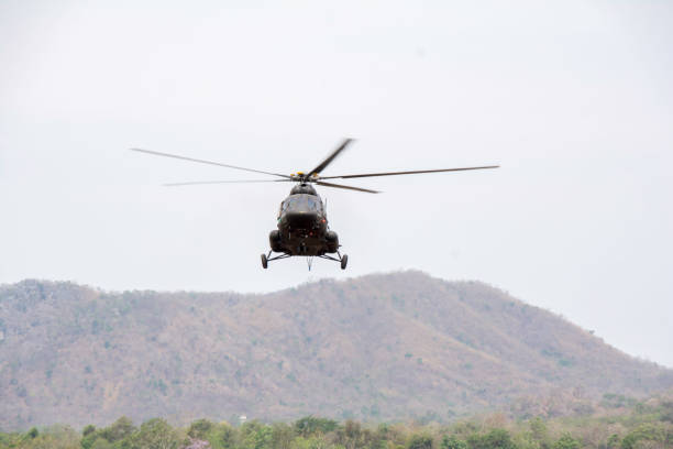 istock Helicopter in flight. Fly over the mountain and  sky 674006526