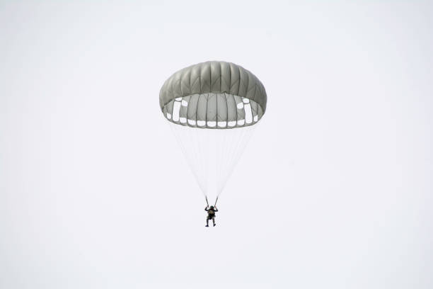 istock Parachute soldiers in the sky. 674006530