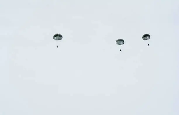 Photo of Three parachute in the sky.