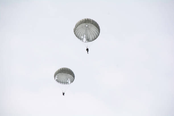 istock Parachute soldiers in the sky. 674006696