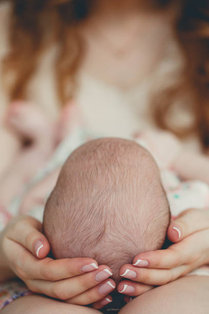 istock Happy mother holding a newborn child 674007116