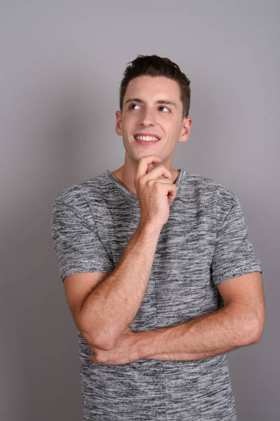 istock Studio shot of young handsome man against gray background 674007540