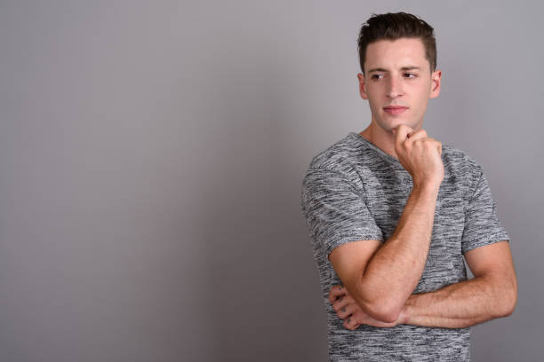 istock Studio shot of young handsome man against gray background 674007736