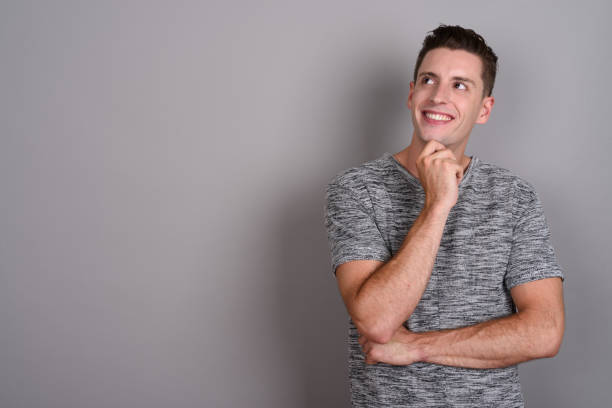 istock Studio shot of young handsome man against gray background 674007970