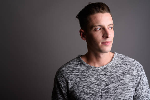 istock Studio shot of young handsome man against gray background 674008284