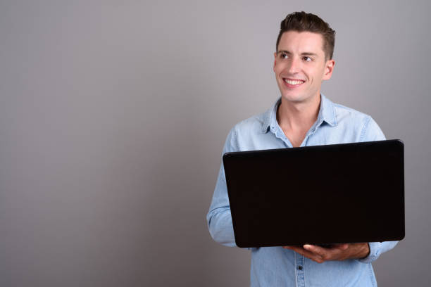 istock Studio shot of young handsome man against gray background 674016272
