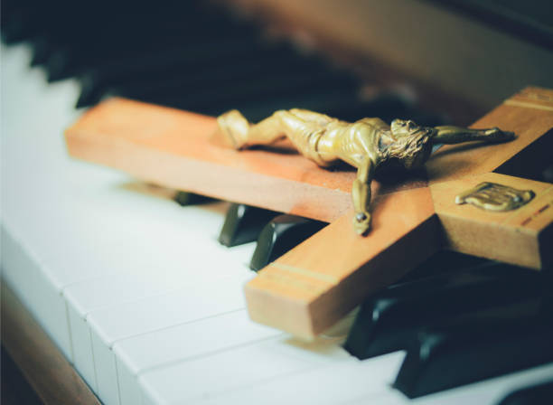 istock the crucifix on piano keys 674035576
