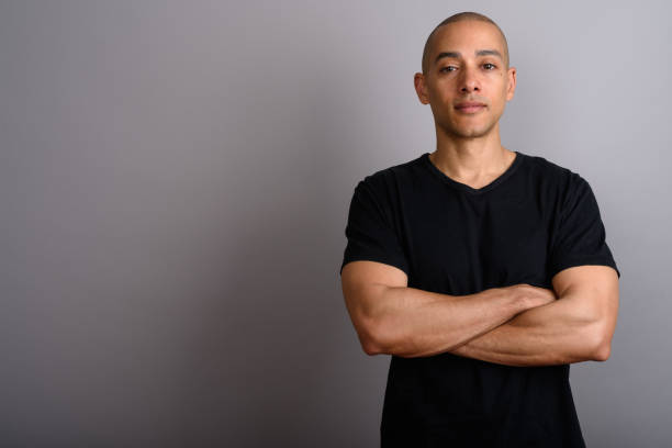 istock Studio shot of mature handsome bald man against gray background 674035690