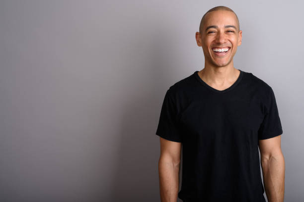 istock Studio shot of mature handsome bald man against gray background 674035700